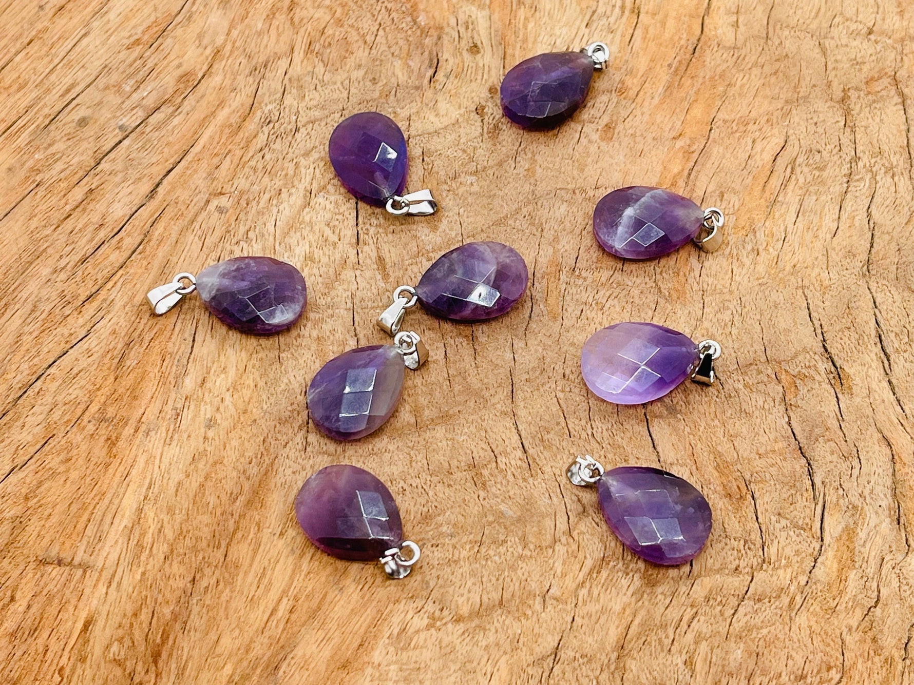 Amethyst crystal pendant, 20mm gemstone for jewelry making, from GemstoneGO, displayed on white background.