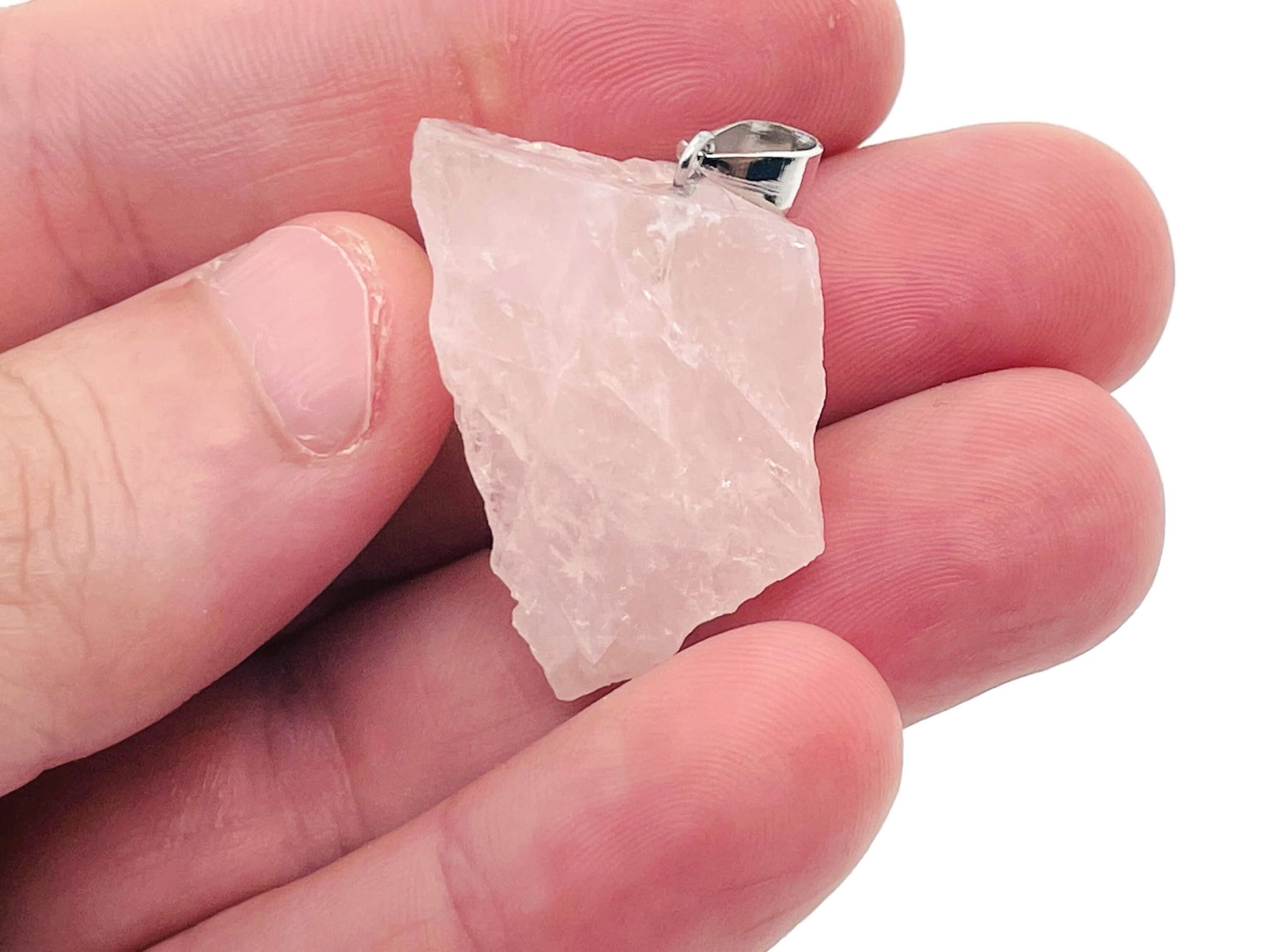 Rose Quartz crystal pendant from GemstoneGO, showcasing a polished pink gemstone with a silver bail on a white background.