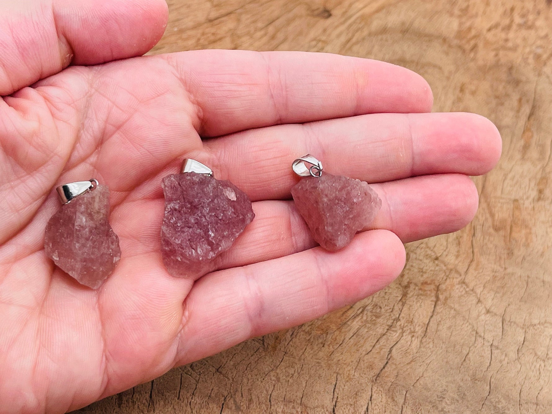 Strawberry Quartz crystal pendant featuring a polished, teardrop-shaped gemstone from GemstoneGO.