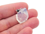 Opalite crystal pendant from GemstoneGO hanging on a silver chain, showcasing its smooth, glowing oval shape.