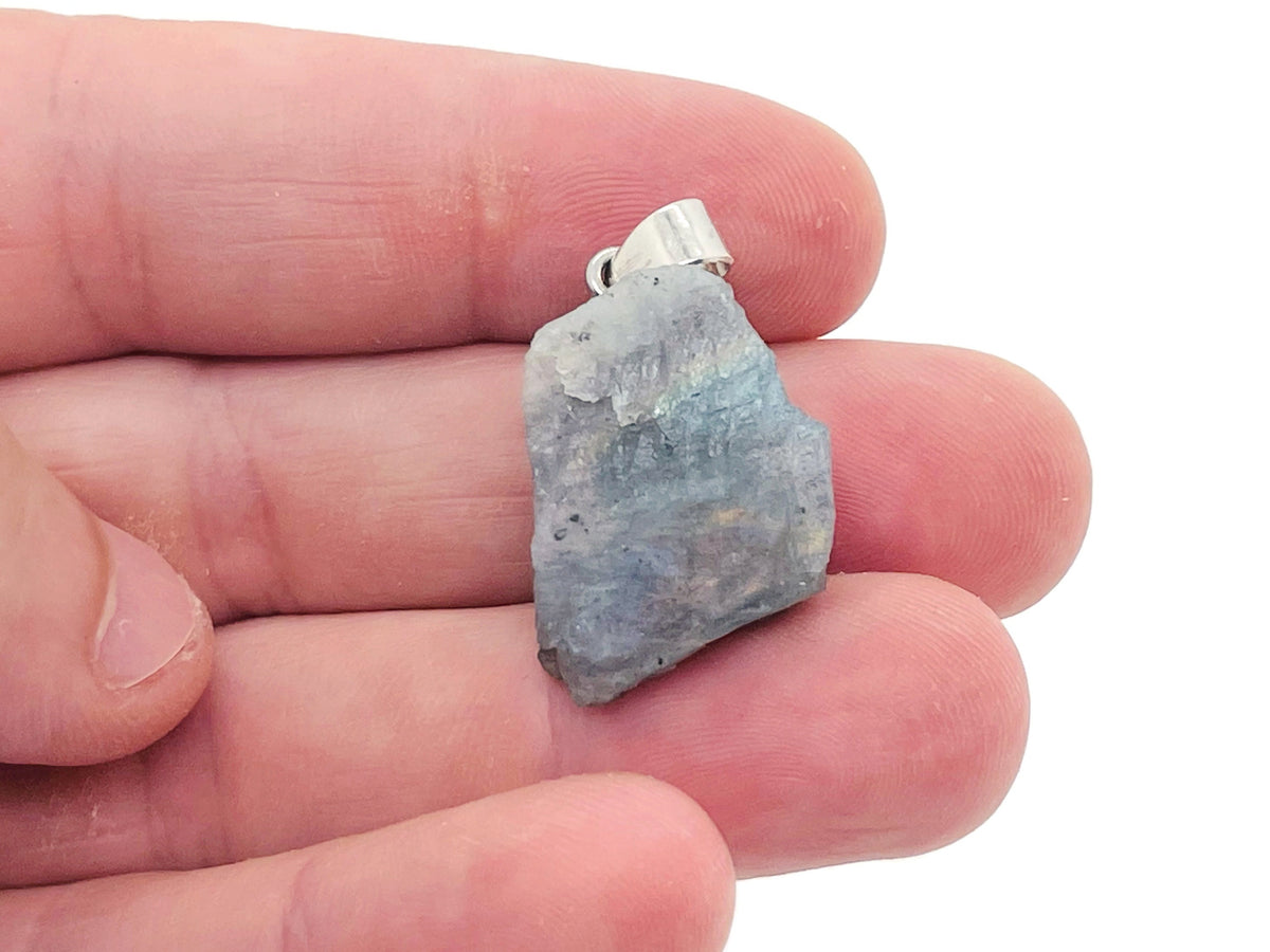 Labradorite crystal pendant from GemstoneGO featuring a polished, oval-shaped gemstone on a silver chain, showcasing iridescent colors.
