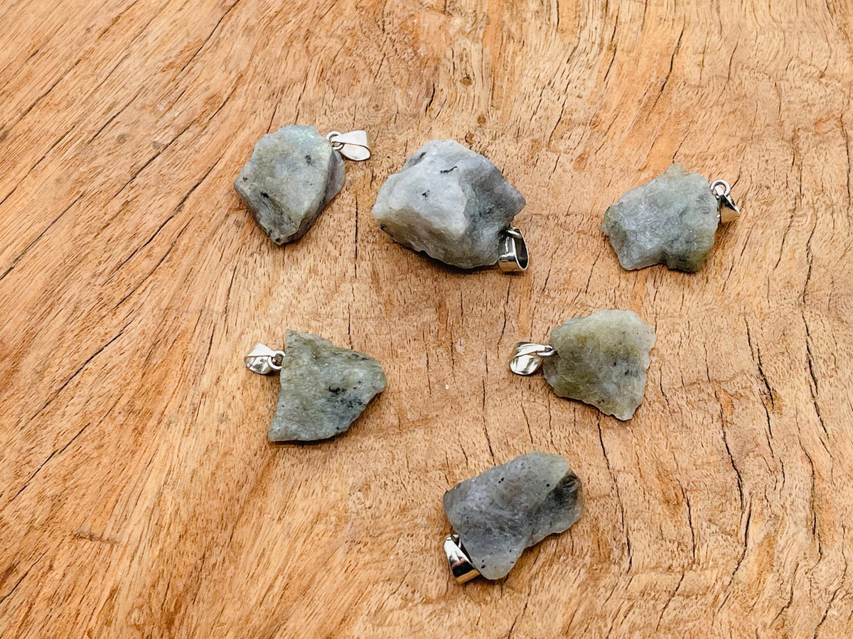 Labradorite crystal pendant from GemstoneGO featuring a polished, irregular-shaped gemstone on a silver chain.