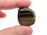 Tiger Eye flat gemstone slab from GemstoneGO, showing smooth, polished golden-brown crystal surface with natural banding and shine.