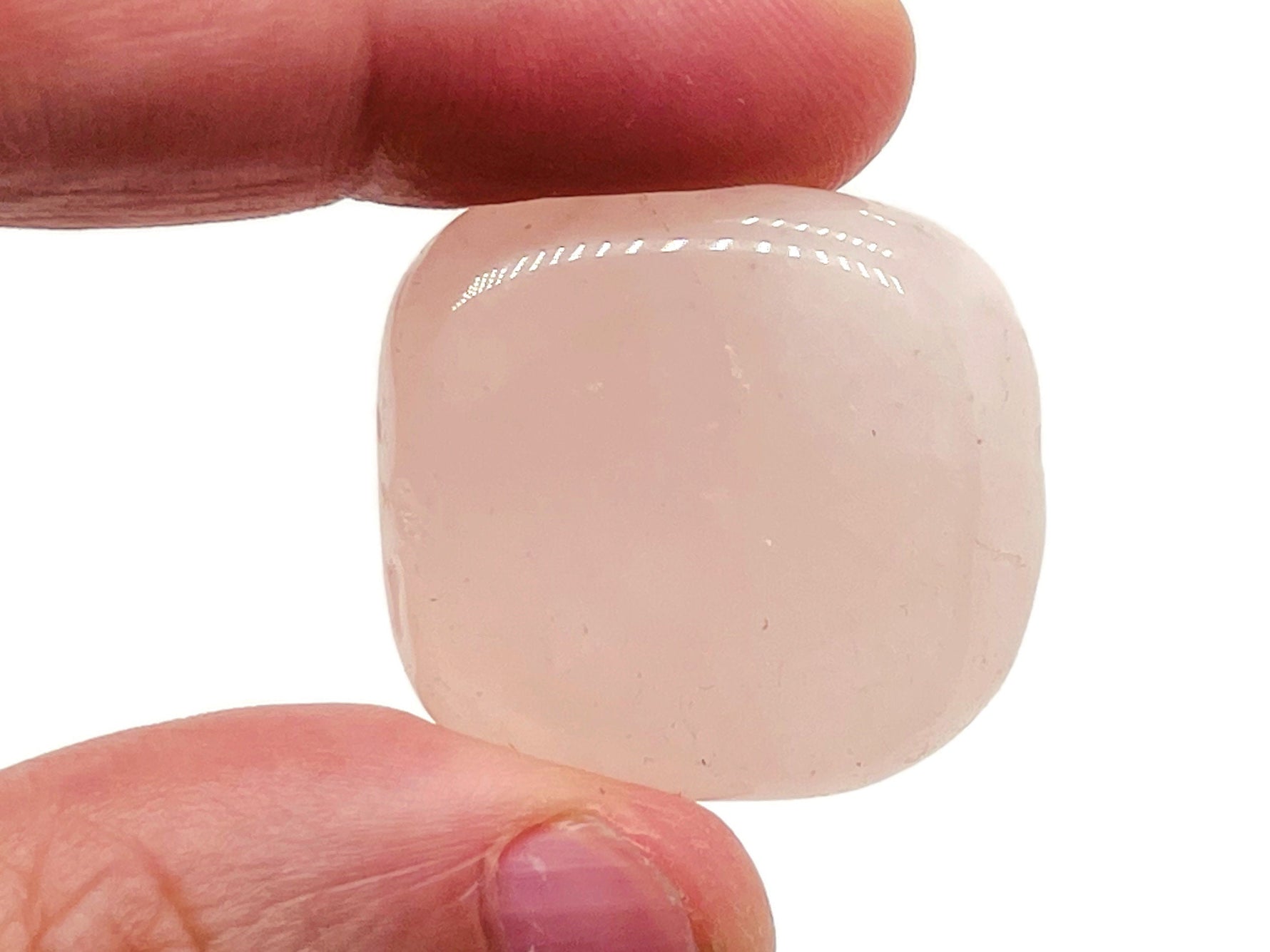 Rose quartz flat gemstone slab from GemstoneGO, showing a pink, polished crystal with natural crystal patterns on a neutral background.