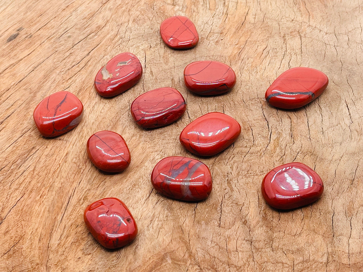 Red Jasper flat gemstone slab from GemstoneGO featuring a smooth, polished red mineral crystal with natural gemstone patterns.