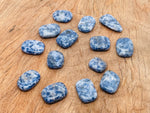 Blue Spot Jasper flat gemstone slab from GemstoneGO, showing vibrant blue spots and natural crystal patterns on a polished surface.