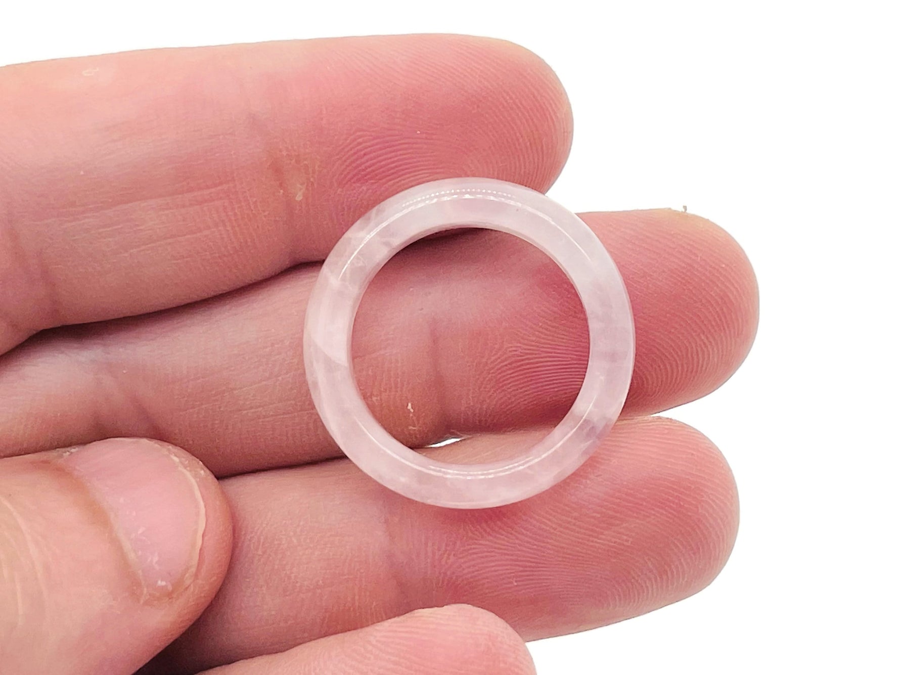 Rose quartz crystal ring by GemstoneGO featuring a polished rose quartz gemstone set in a silver band.