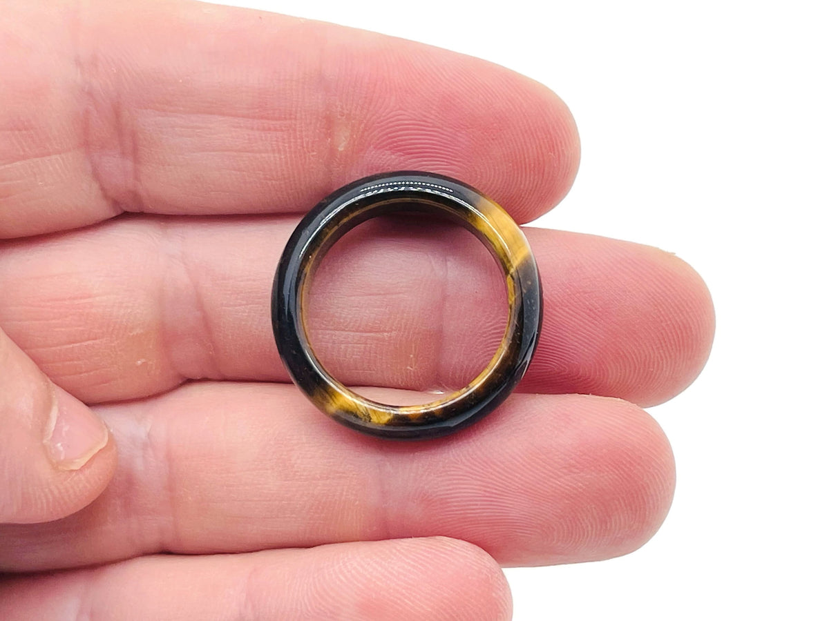 Tiger Eye crystal ring by GemstoneGO featuring a polished golden-brown gemstone set in a silver band.