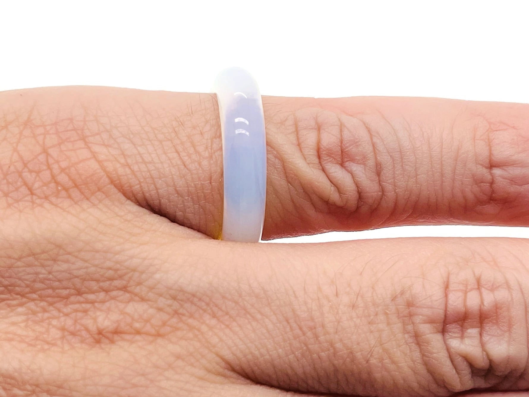 Opalite crystal ring by GemstoneGO featuring a smooth, oval-shaped opalite gemstone set in a silver band, jewelry accessory.