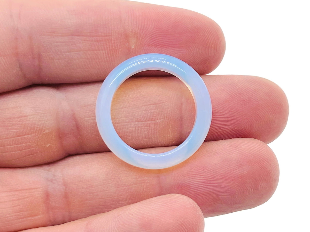 Opalite crystal ring by GemstoneGO featuring a smooth, oval-shaped opalite gemstone set in a silver band.