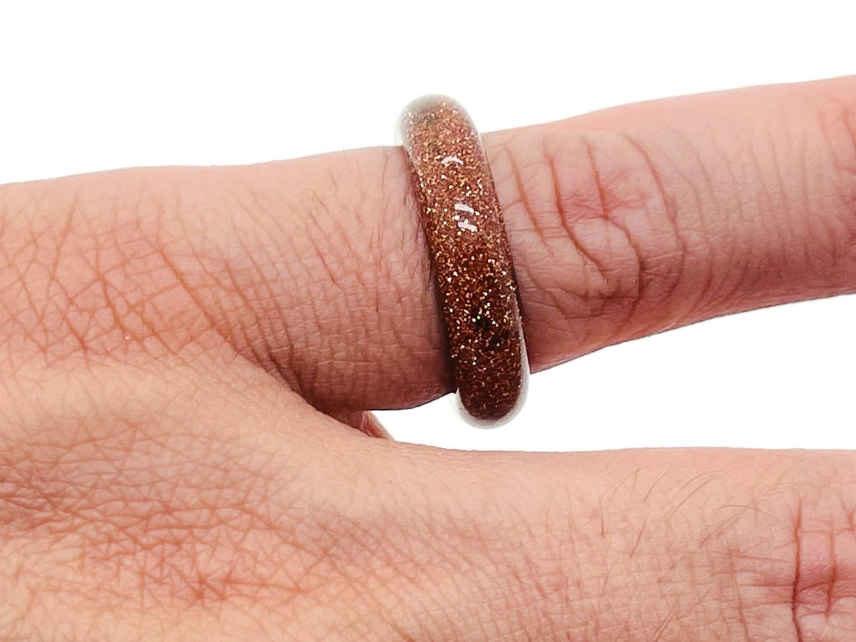 Goldstone crystal ring by GemstoneGO featuring a shimmering goldstone gemstone set in a sleek metal band.