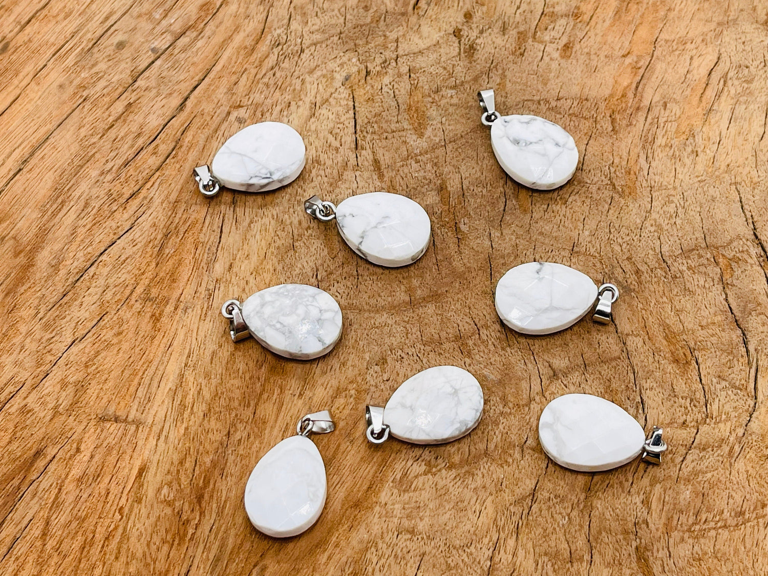 Howlite crystal pendant in a 20mm size, jewelry making supply by GemstoneGO, featuring a polished, gray and white marbled stone.