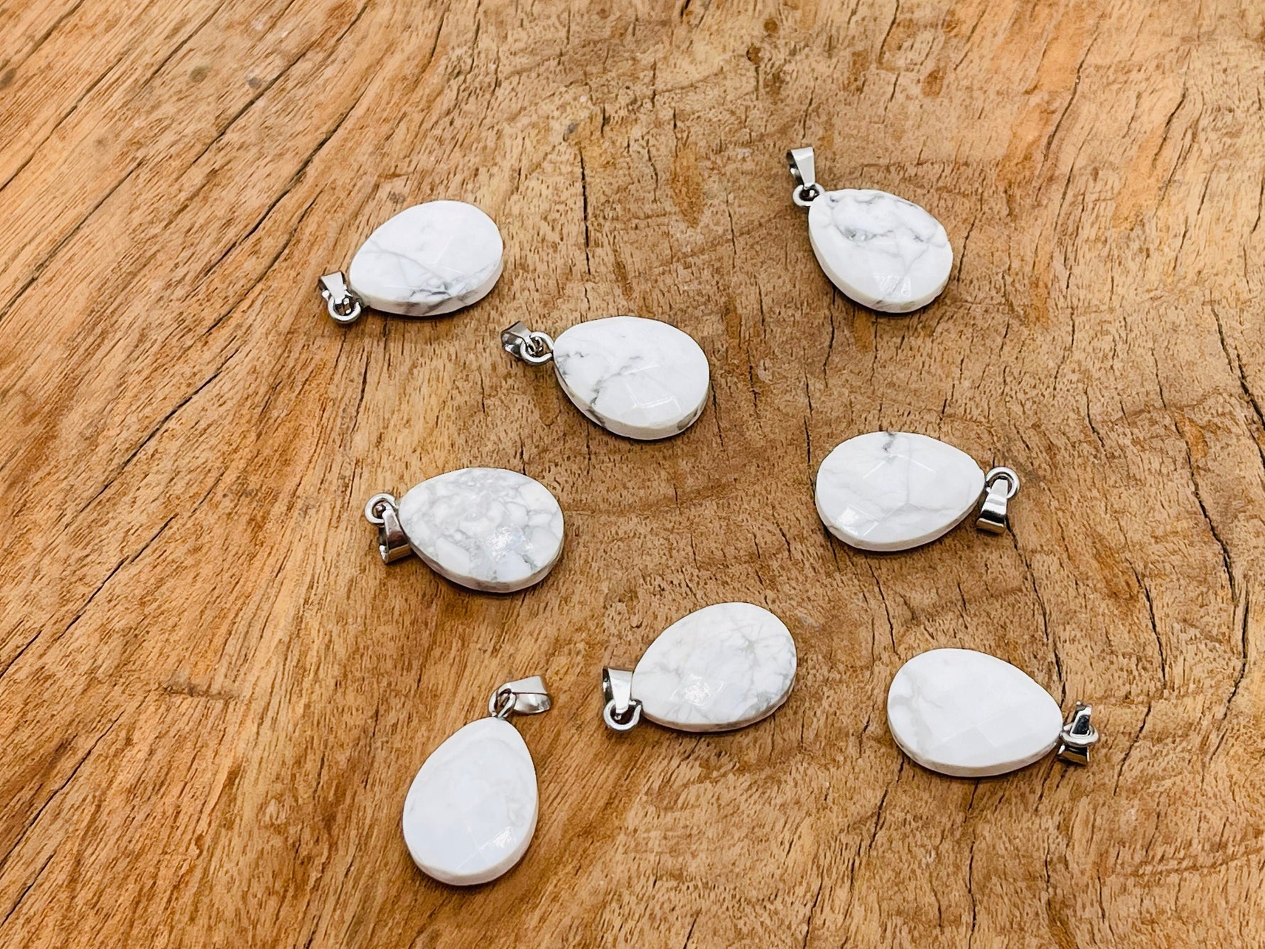Howlite crystal pendant in a 20mm size, jewelry making supply by GemstoneGO, featuring a polished, gray and white marbled stone.