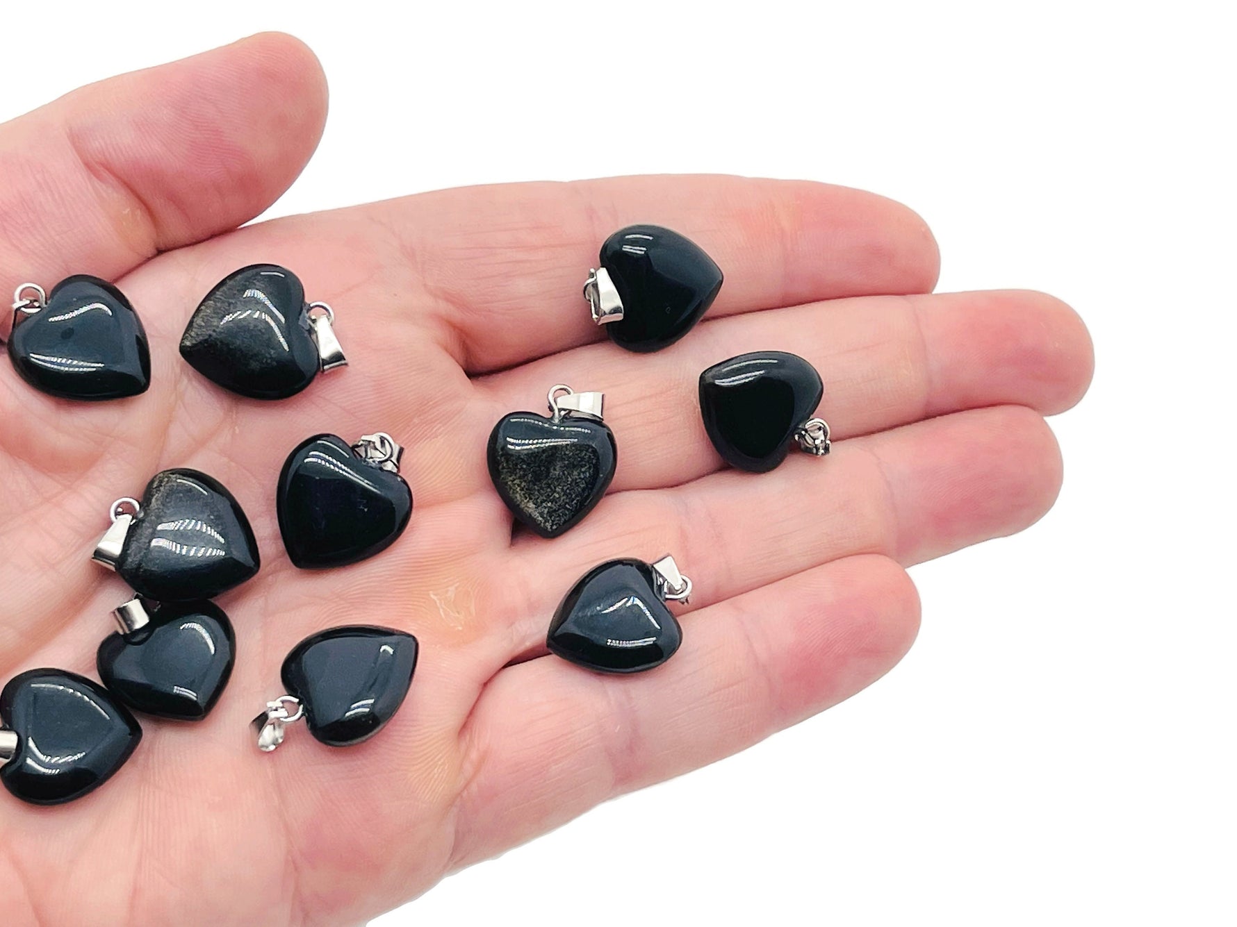 Mini obsidian heart pendant from GemstoneGO featuring a polished black crystal heart necklace.