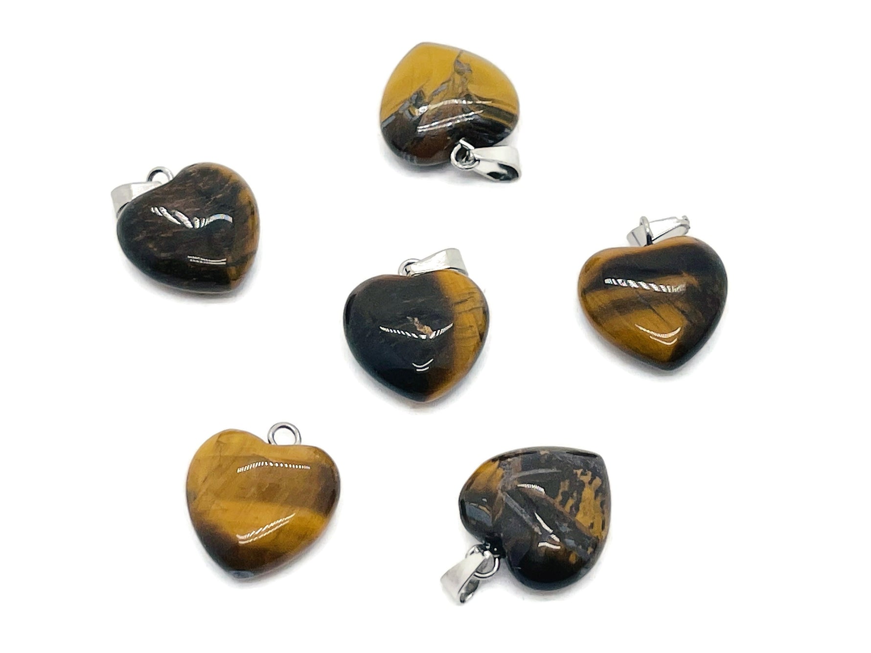 Tiger Eye heart pendant by GemstoneGO, a mini crystal pendant with a polished tiger eye stone in a heart shape.