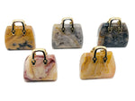 Crazy Lace Agate crystal handbag pendant featuring a carved gemstone with intricate patterns, perfect for jewelry or accessories.