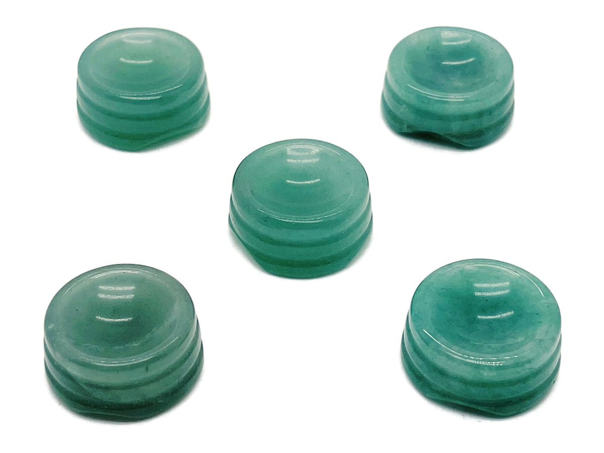 Aventurine crystal sphere on a carved gemstone stand, showcasing a polished green gemstone for home decor display.