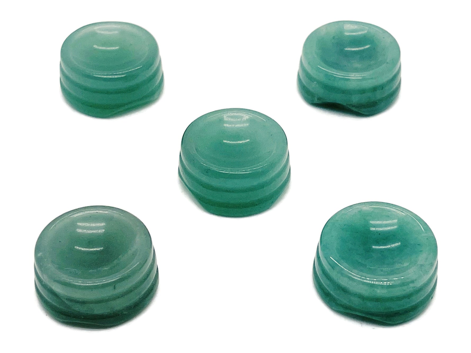 Aventurine crystal sphere on a carved gemstone stand, showcasing a polished green gemstone for home decor display.