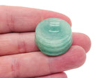 Aventurine crystal sphere on a carved gemstone stand, showcasing vibrant green hues, ideal for home decor display.