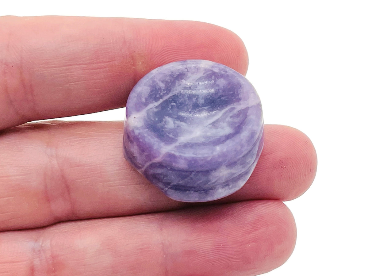 Lepidolite crystal sphere on a carved gemstone stand, used as elegant home decor piece by GemstoneGO.