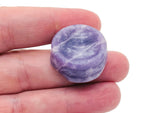 Lepidolite crystal sphere on a carved gemstone stand, used as elegant home decor piece by GemstoneGO.