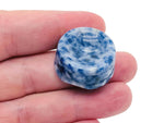 Blue Spot Jasper crystal sphere on a carved gemstone stand, used as a decorative home decor piece.
