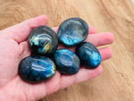 Labradorite palm gemstone spa stone from GemstoneGO, smooth polished natural stone for relaxation and massage.