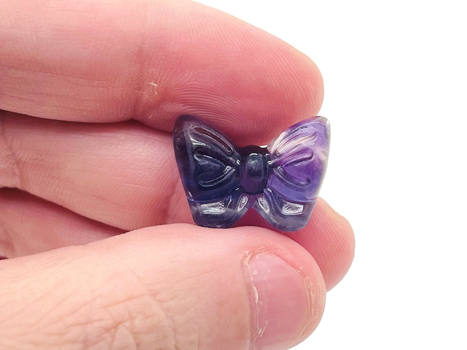 Fluorite butterfly gemstone carving by GemstoneGO, showcasing vibrant purple and green hues with detailed butterfly design.