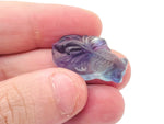 Colorful fluorite aquarium fish carving gemstone with intricate details, showcasing vibrant hues and craftsmanship by GemstoneGO.
