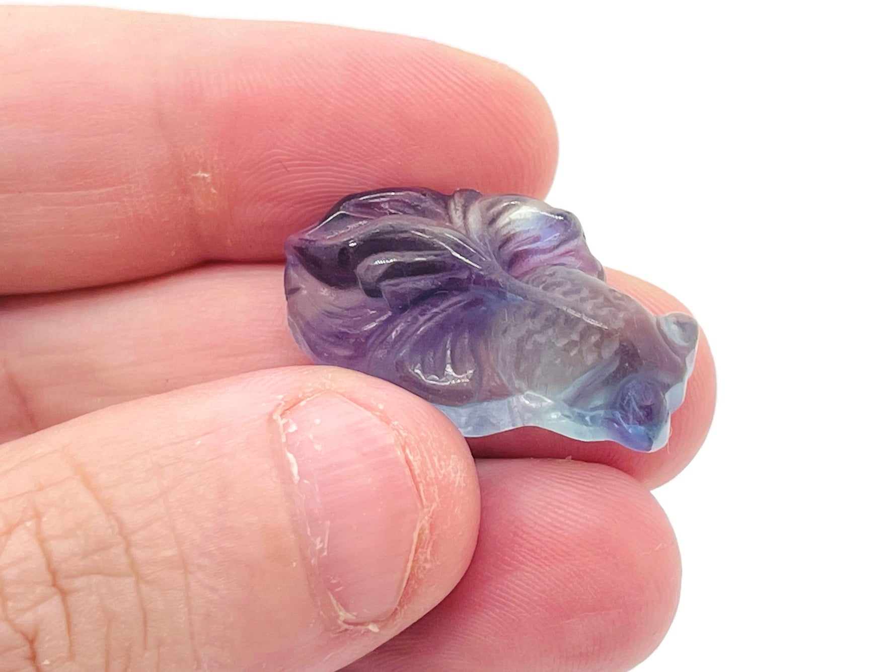 Colorful fluorite aquarium fish carving gemstone with intricate details, showcasing vibrant hues and craftsmanship by GemstoneGO.