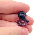 Fluorite angel kid gemstone carving by GemstoneGO, featuring a colorful, detailed angel figure carved from vibrant fluorite gemstone.