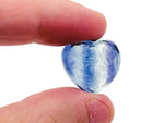 Polished fluorite heart-shaped gemstone carving from GemstoneGO, vibrant purple and green hues with smooth, detailed surface.