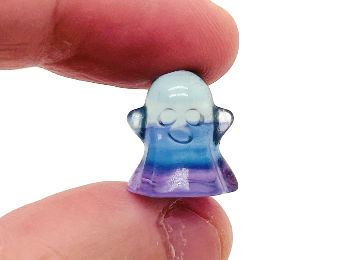 Mini Fluorite ghost carving gemstone from GemstoneGO, showcasing vibrant purple and green colors with detailed ghost design.