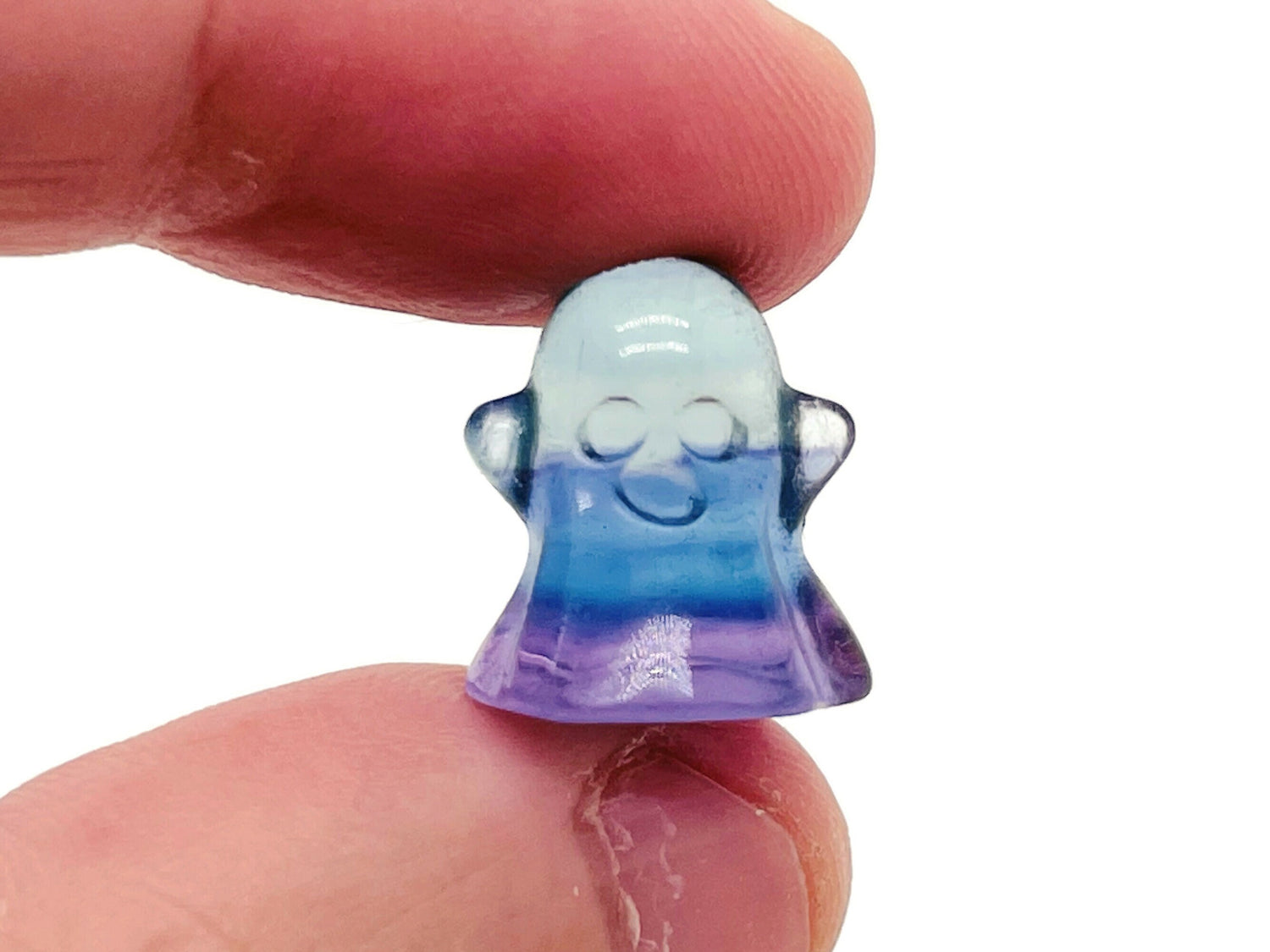 Mini Fluorite ghost carving gemstone from GemstoneGO, showcasing vibrant purple and green colors with detailed ghost design.