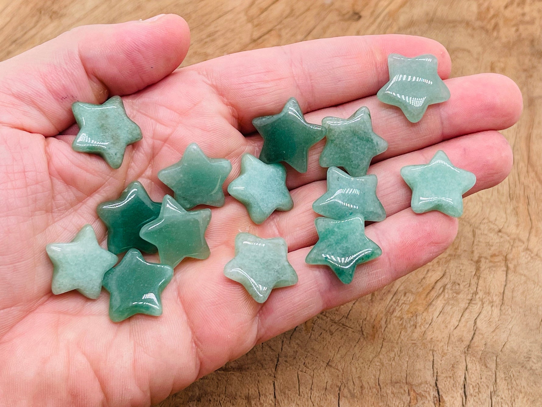 Small 2mm aventurine star gemstone from GemstoneGO, showcasing a vibrant green polished mineral with star-shaped inclusions.