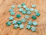 Small 2mm aventurine star gemstone from GemstoneGO, featuring a polished green stone with a star pattern design.