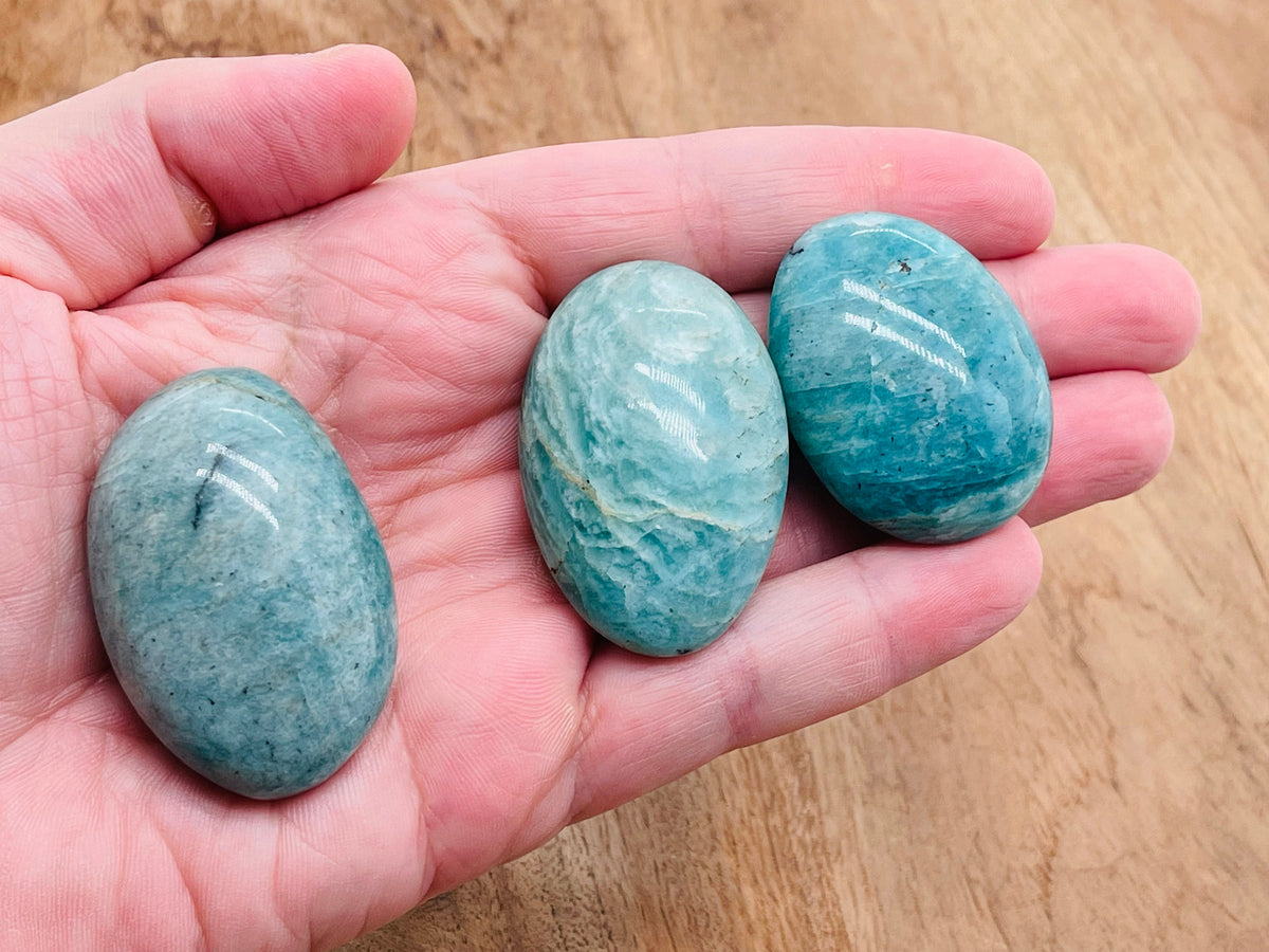 Amazonite palm gemstone spa stone from GemstoneGO, showing a smooth, polished blue-green gemstone ideal for relaxation and massage.