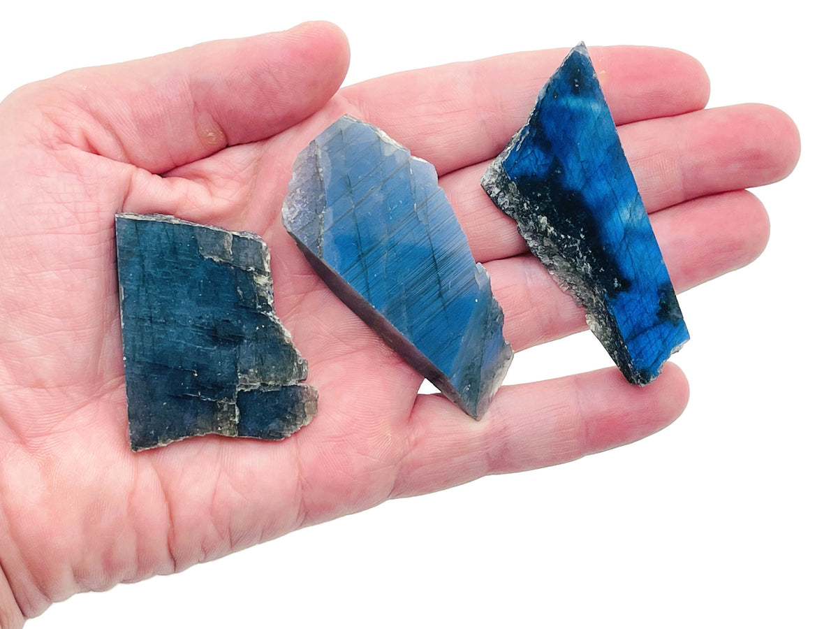 Labradorite flat gemstone slab from GemstoneGO showcasing iridescent blue and green hues in a polished crystal piece.