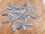 Raw Kyanite gemstone from GemstoneGO, showcasing its deep blue crystal structure and natural rough form.