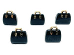Obsidian crystal handbag pendant with carved gemstone design, featuring a polished, dark stone on a jewelry chain.
