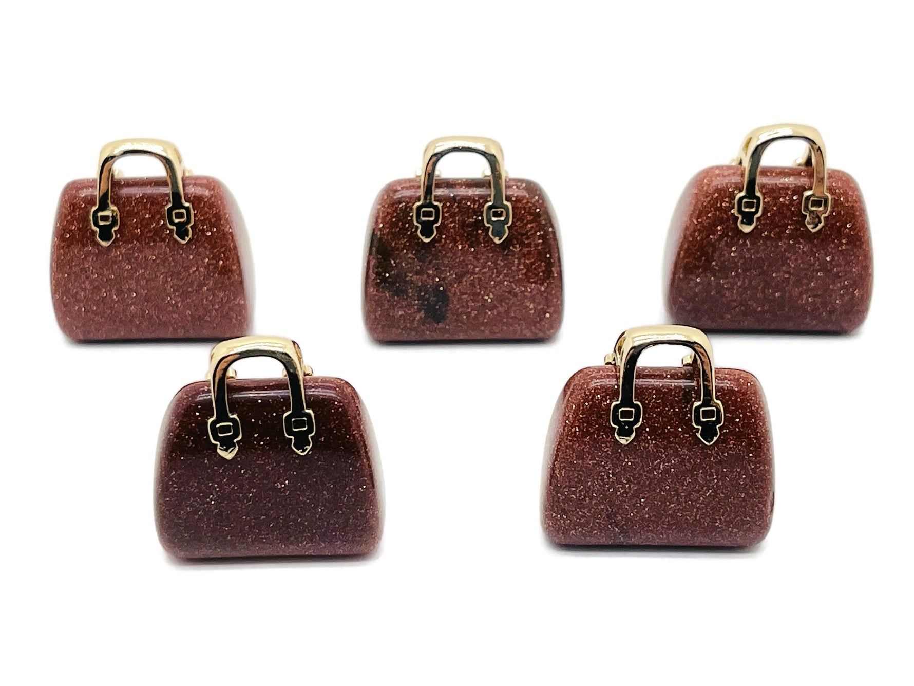 Goldstone crystal purse carving gemstone pendant featuring a detailed handbag design, crafted by GemstoneGO.