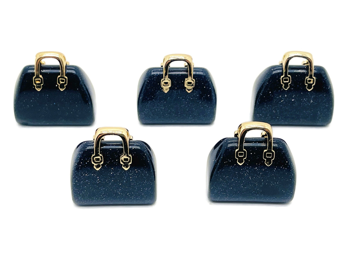 Blue Goldstone crystal handbag pendant with gold accents, carved gemstone showcasing detailed craftsmanship and vibrant blue sparkle.