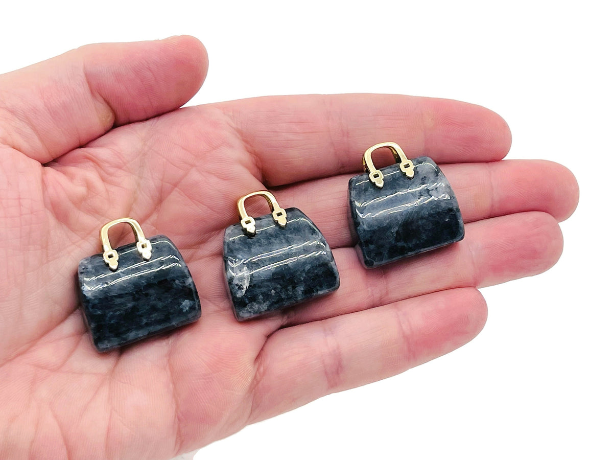 Larvikite crystal carving pendant shaped like a handbag, gemstone jewelry accessory with intricate details, from GemstoneGO.