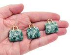 Green Jade crystal handbag pendant featuring a carved green dot design, perfect for jewelry and accessory embellishments.