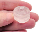 Rose quartz crystal sphere on a carved gemstone stand, used as elegant home decor piece by GemstoneGO.