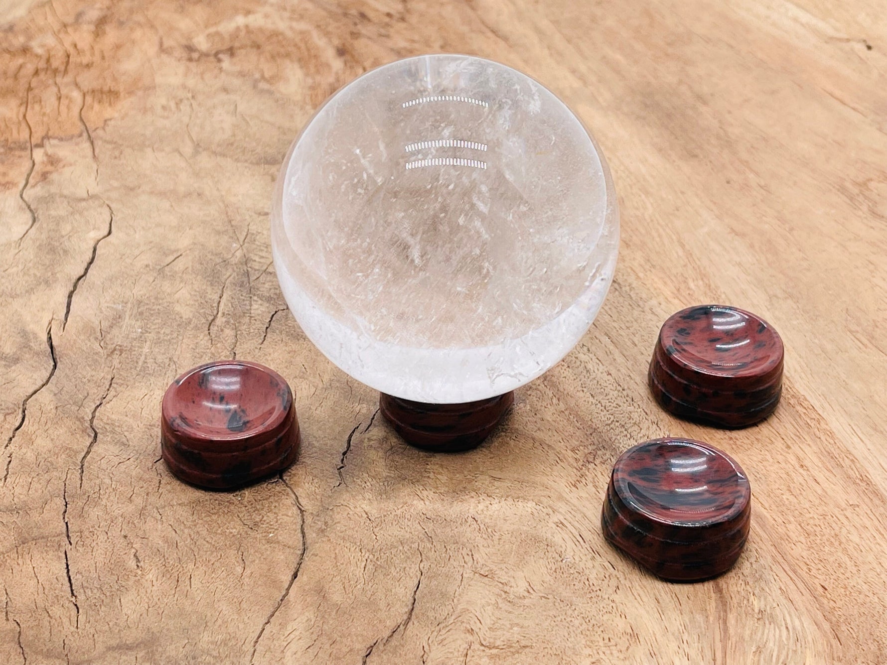 Mahogany Obsidian crystal sphere on carved gemstone stand, decorative home decor piece by GemstoneGO.