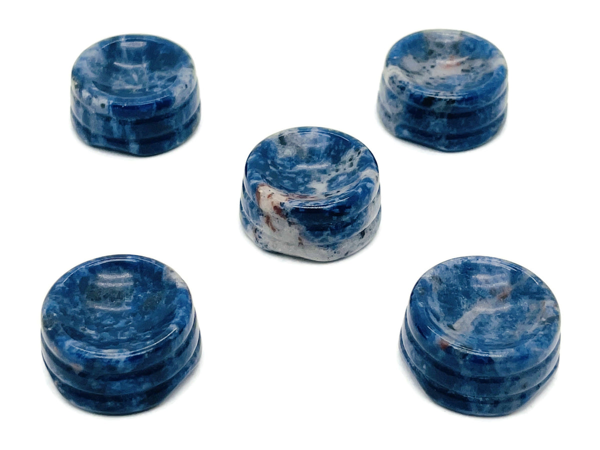 Sodalite crystal sphere with carved gemstone stand, ideal for home decor display by GemstoneGO.