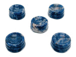 Sodalite crystal sphere with carved gemstone stand, ideal for home decor display by GemstoneGO.