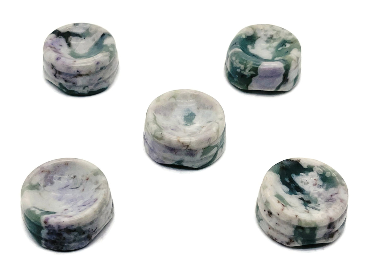 Peace Jade crystal sphere resting on a carved gemstone stand, used as elegant home decor piece by GemstoneGO.