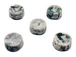 Peace Jade crystal sphere resting on a carved gemstone stand, used as elegant home decor piece by GemstoneGO.